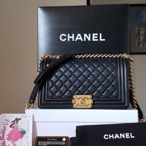 CHANEL Handbags - Chanel black lambskin bag gold hw old medium bag